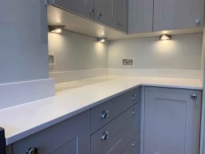 Quartz kitchen worktop on blue cabinets